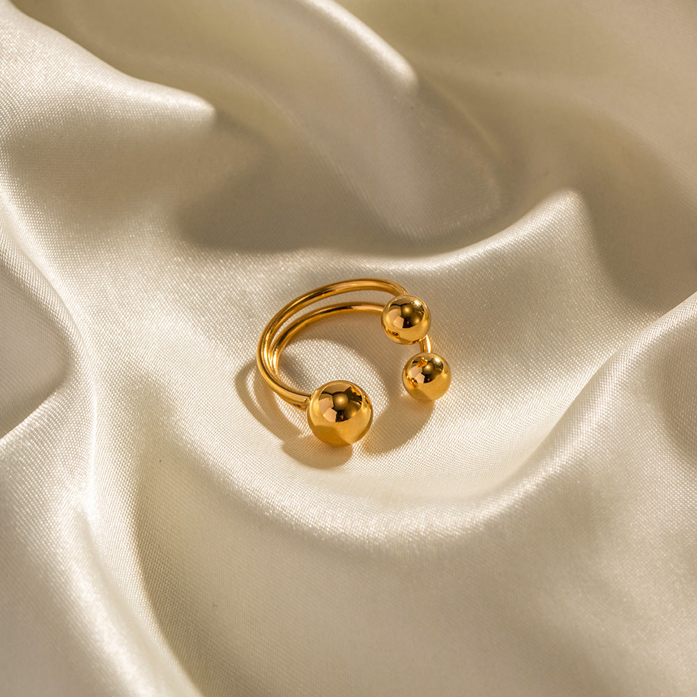 Anillo abierto tres bolas oro 