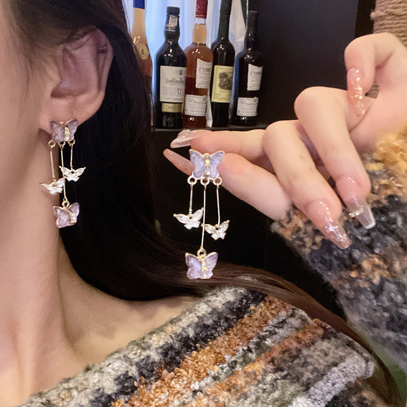 Pendientes largos con flecos de mariposa morada 