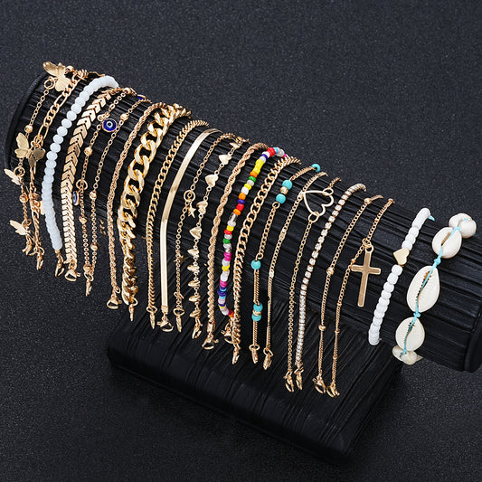 Juego de 22 tobilleras de conchas y cuentas doradas 