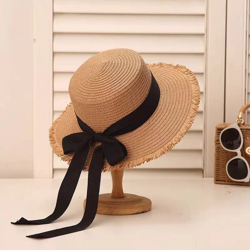 Sombrero de paja con lazo de tendencia para mujer, sombrero de ala plana tejido para vacaciones de verano 