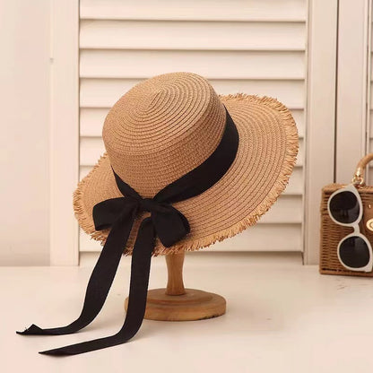 Sombrero de paja con lazo de tendencia para mujer, sombrero de ala plana tejido para vacaciones de verano 