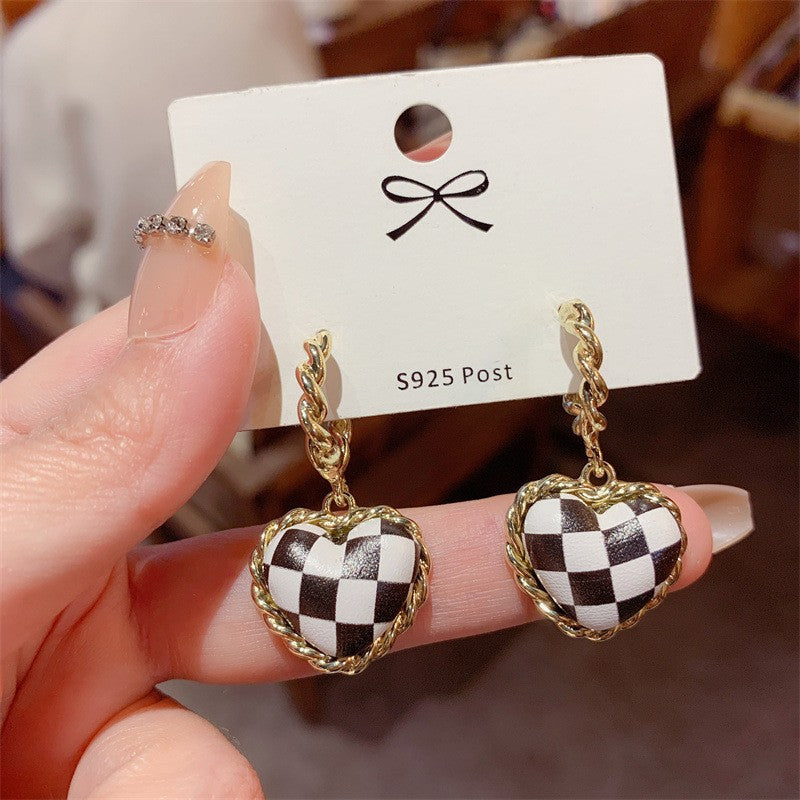 Black leather heart checkerboard stud earrings