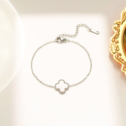 Pulseira feminina em aço titânio - trevo preto e branco, corrente em ouro rosa 