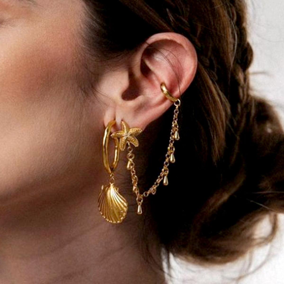 Single starfish teardrop ear clip