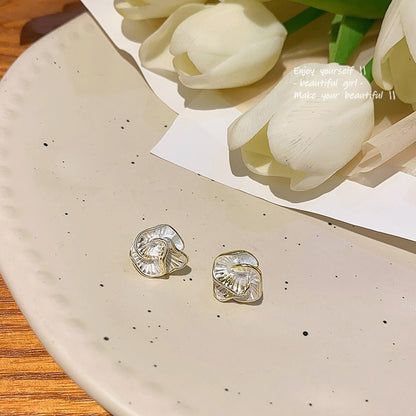 Drip glaze camellia stud earrings are simple