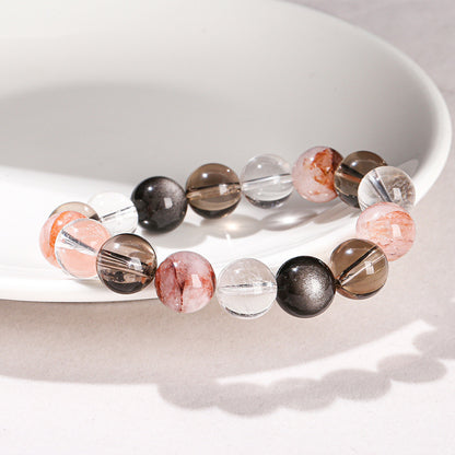 Pulsera de cuentas redondas con hilo mixto de obsidiana plateada y cristal blanco de té 