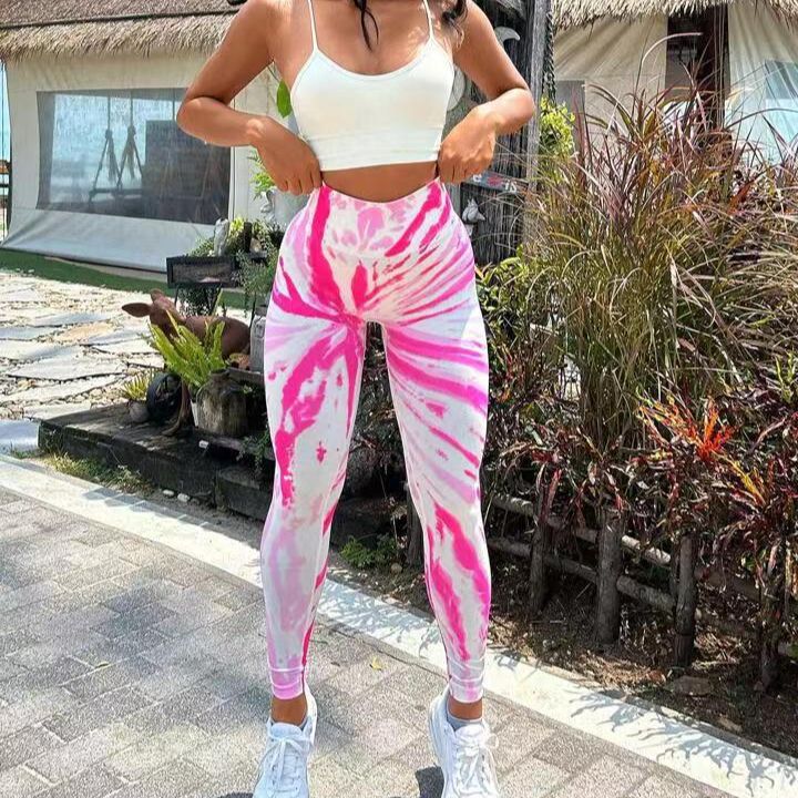 Pantalones de yoga color melocotón sin costuras con efecto tie-dye 