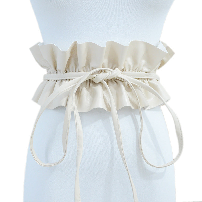 Elastic pleated edge belt