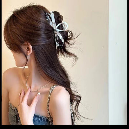 Large silver bow grab clip female