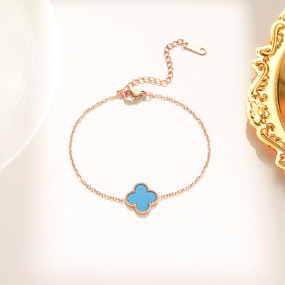 Pulseira feminina em aço titânio - trevo preto e branco, corrente em ouro rosa 