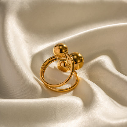 Exaggerated three ball open ring