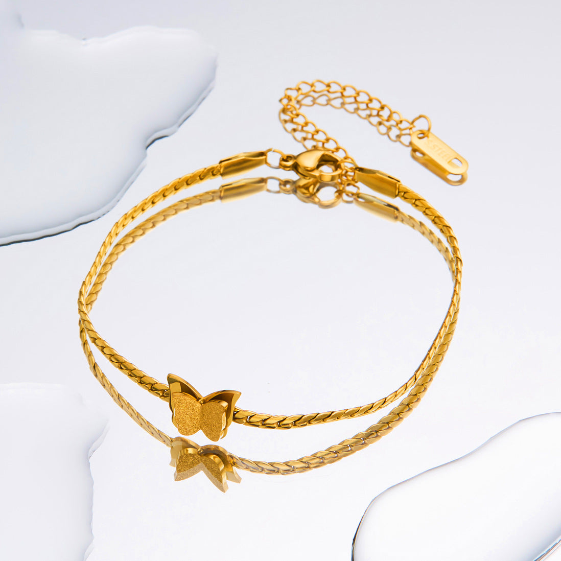 Titanium-Steel Snake Bone Whip Chain Bracelet with Four-Leaf Clover