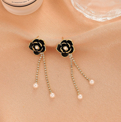 Diamond-encrusted black camellia earrings for women
