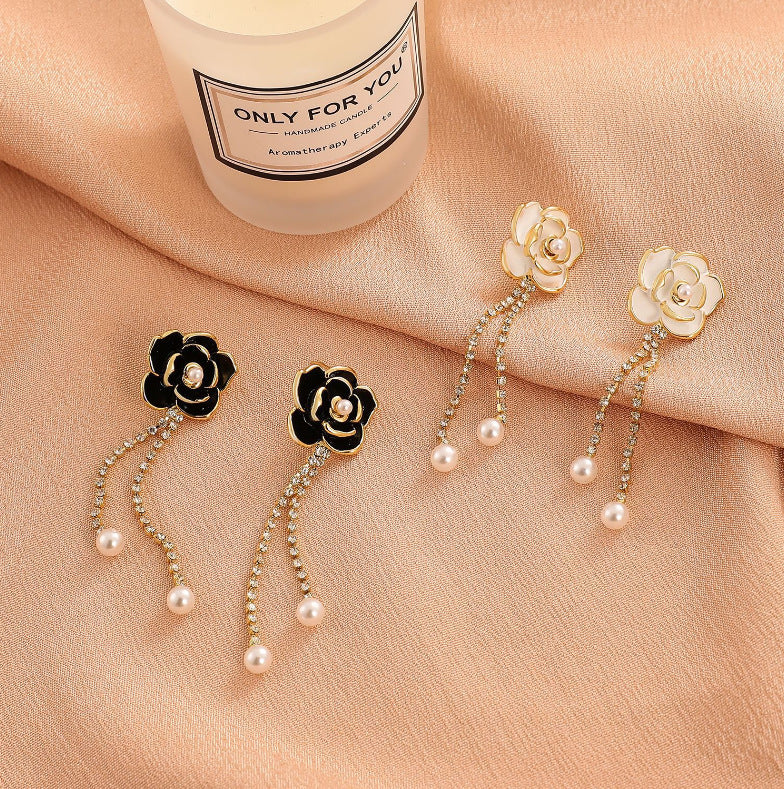 Diamond-encrusted black camellia earrings for women