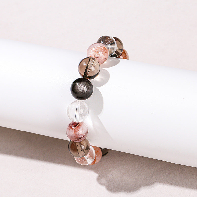 Pulsera de cuentas redondas con hilo mixto de obsidiana plateada y cristal blanco de té 