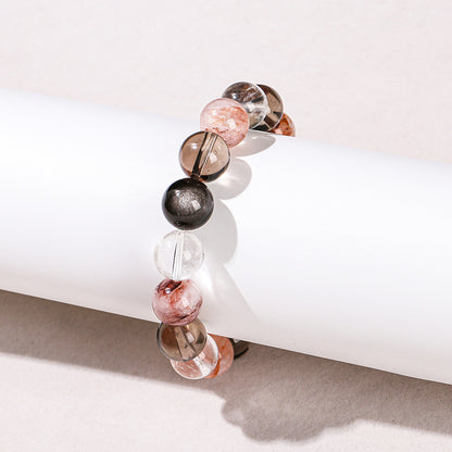 Pulsera de cuentas redondas con hilo mixto de obsidiana plateada y cristal blanco de té 