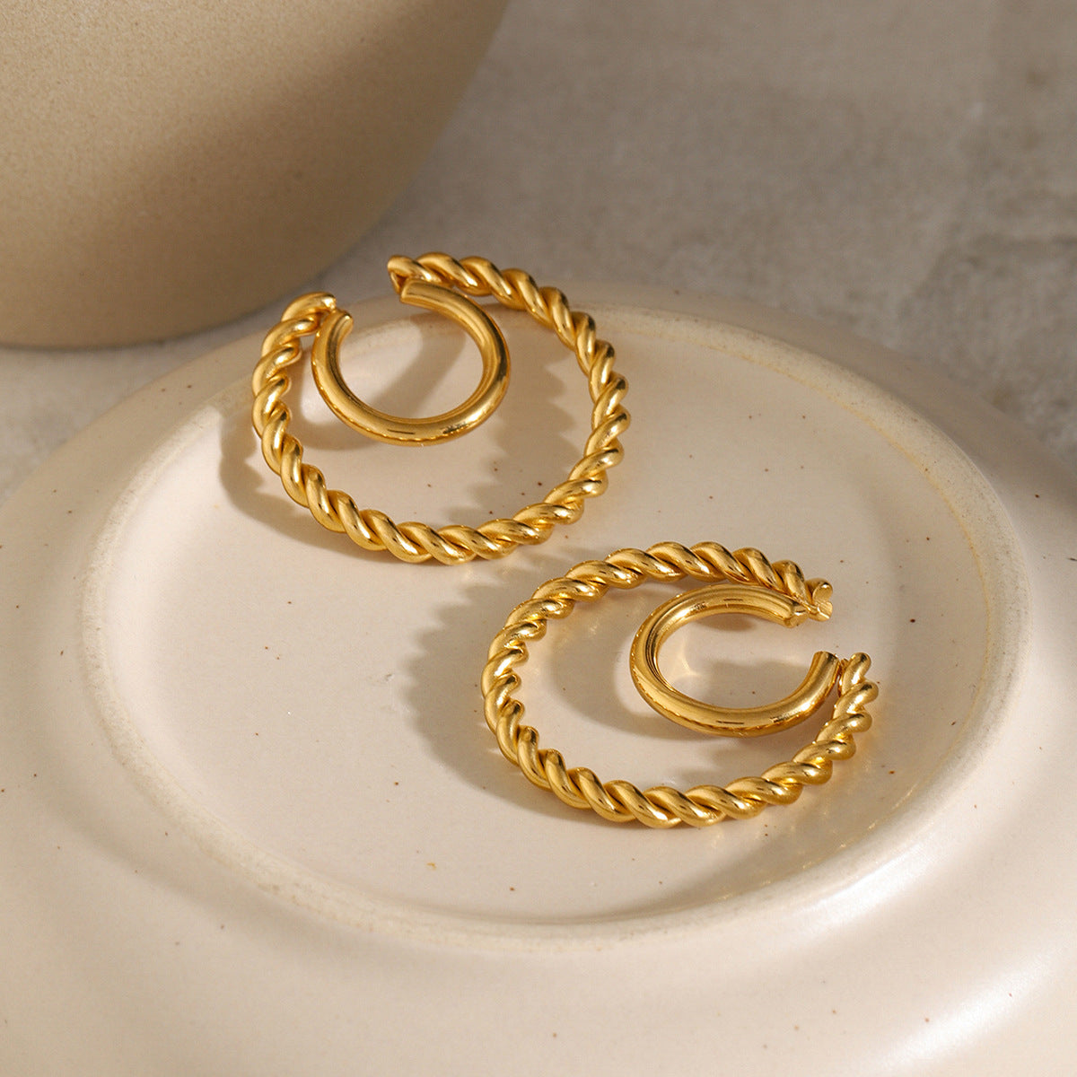 Double layer ear clip with twist coil