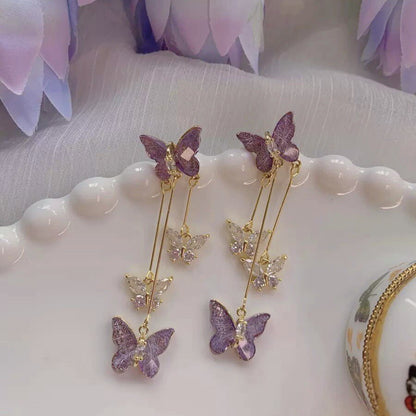 Pendientes largos con flecos de mariposa morada 