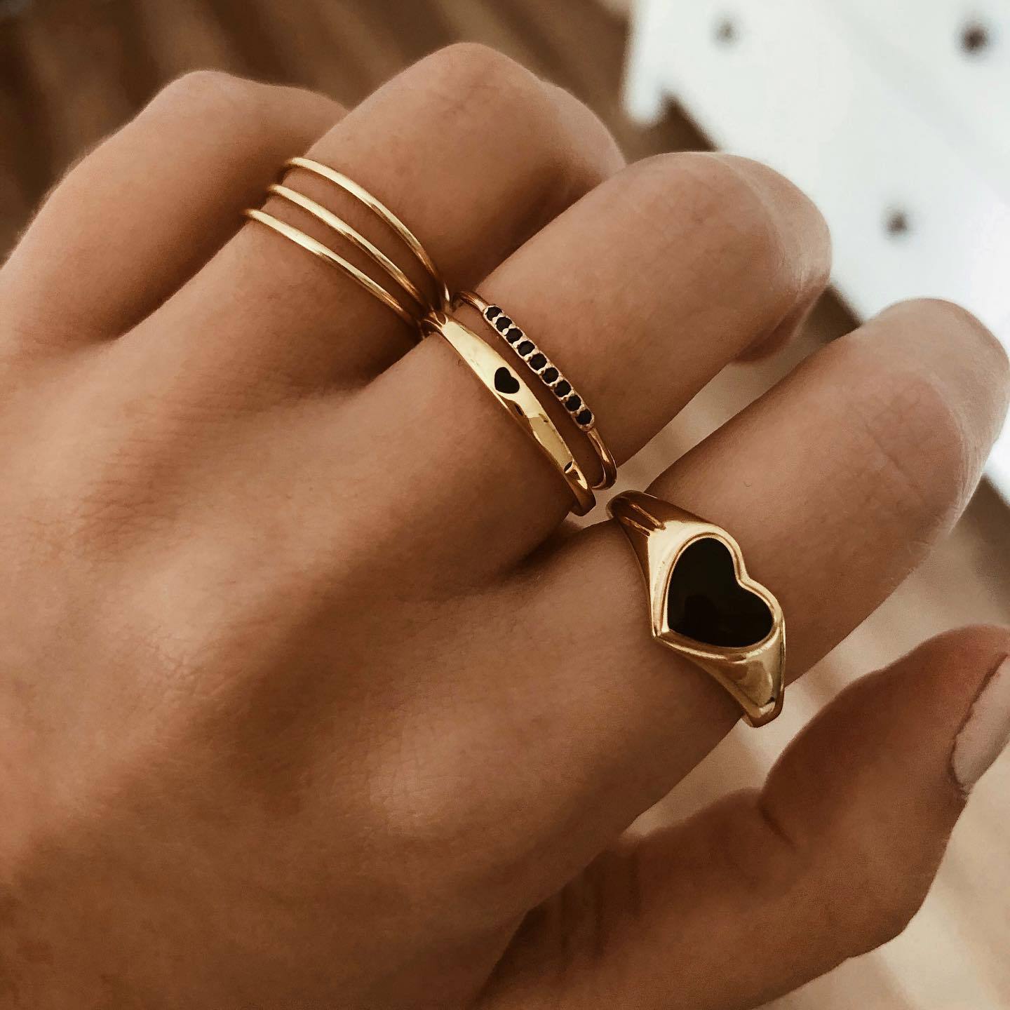 Three black oil dripping heart rings