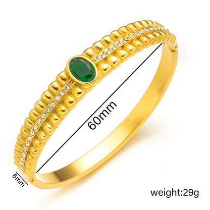 Brazalete vintage de acero inoxidable con circonitas verdes 