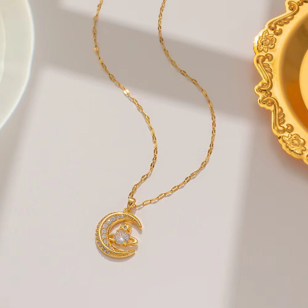 Conjunto de collar y anillo Saturno con luna y circonitas dobles de Vivienne 
