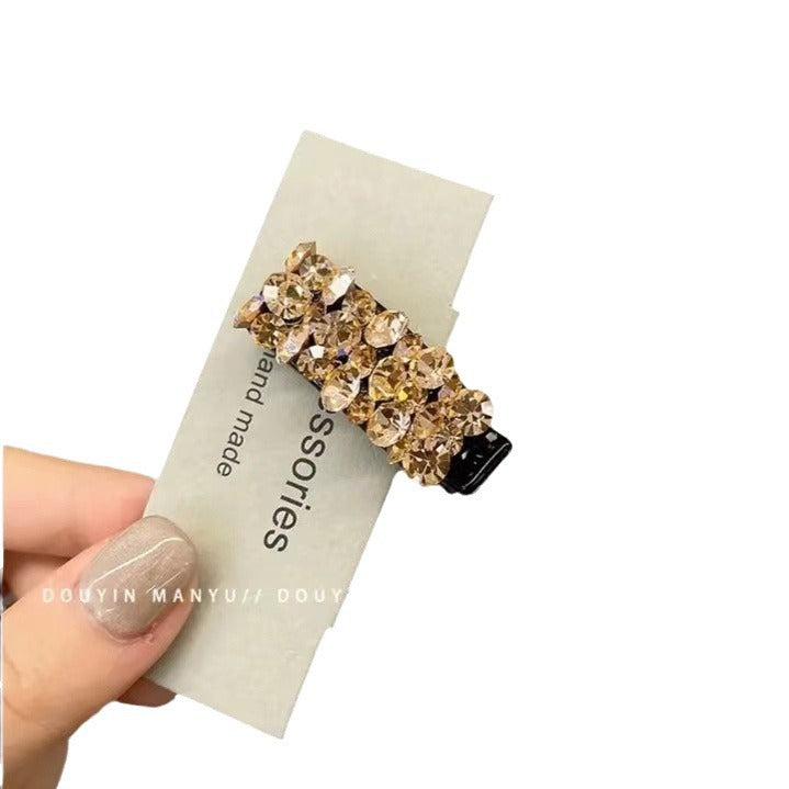 Pinza para el pelo elegante con clip lateral de diamantes de imitación de colores 