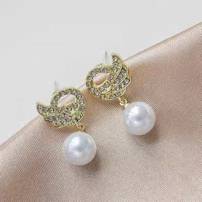 Diamond swan pearl stud earrings