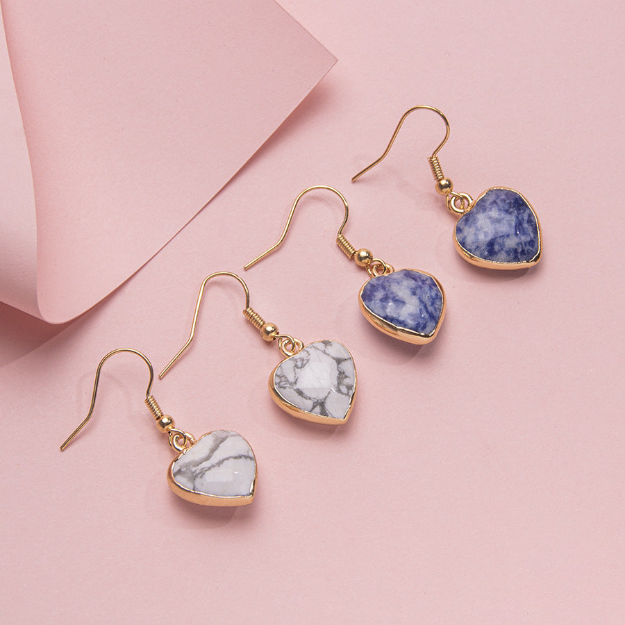 Brincos de aço inoxidável com coração de cristal facetado com borda dourada 