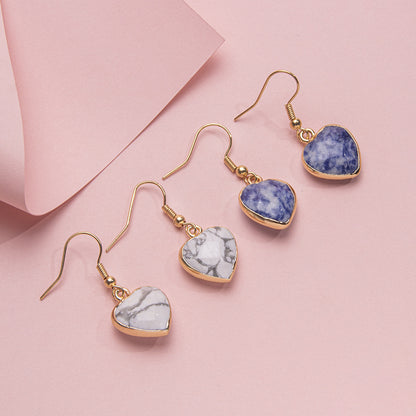 Brincos de aço inoxidável com coração de cristal facetado com borda dourada 