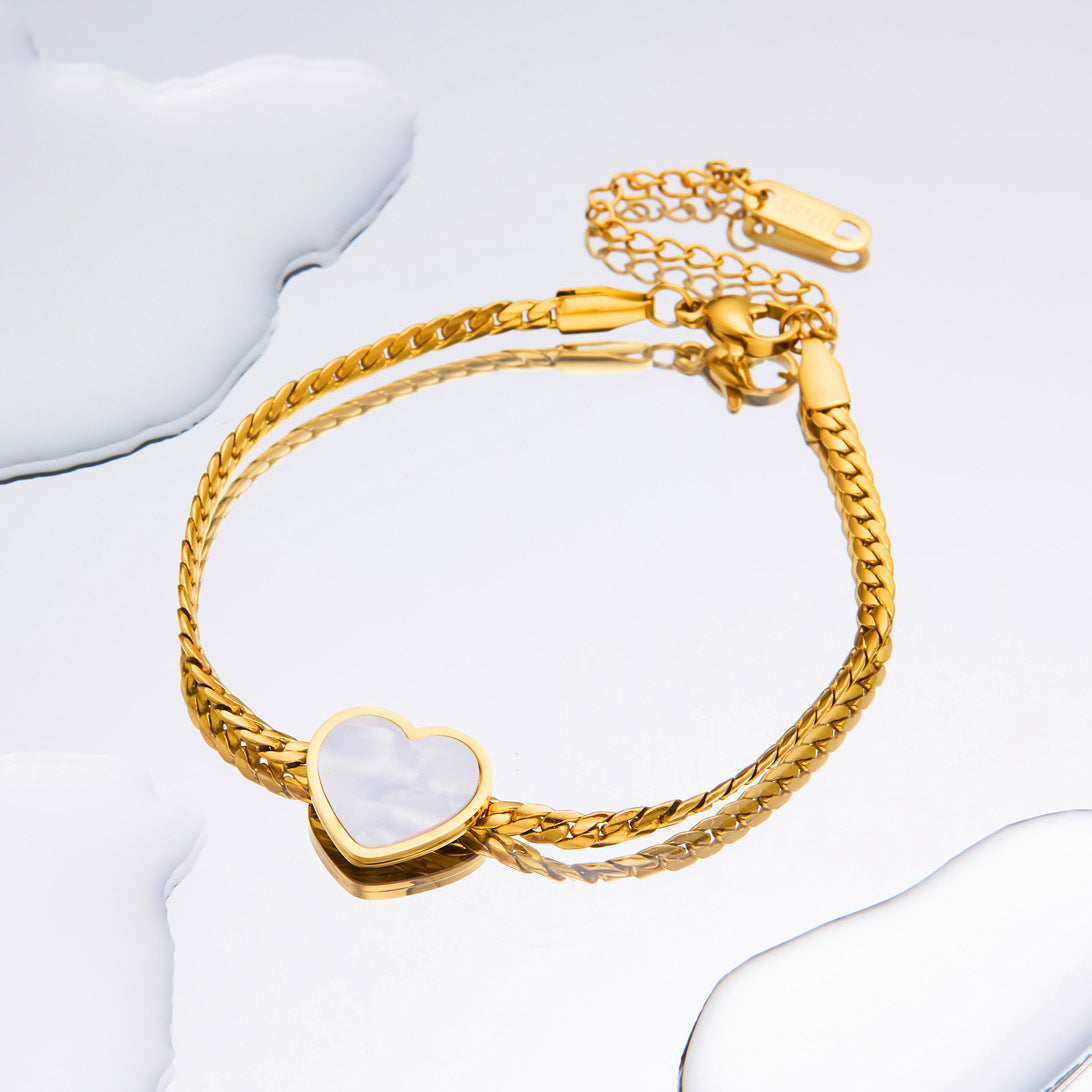 Titanium-Steel Snake Bone Whip Chain Bracelet with Four-Leaf Clover