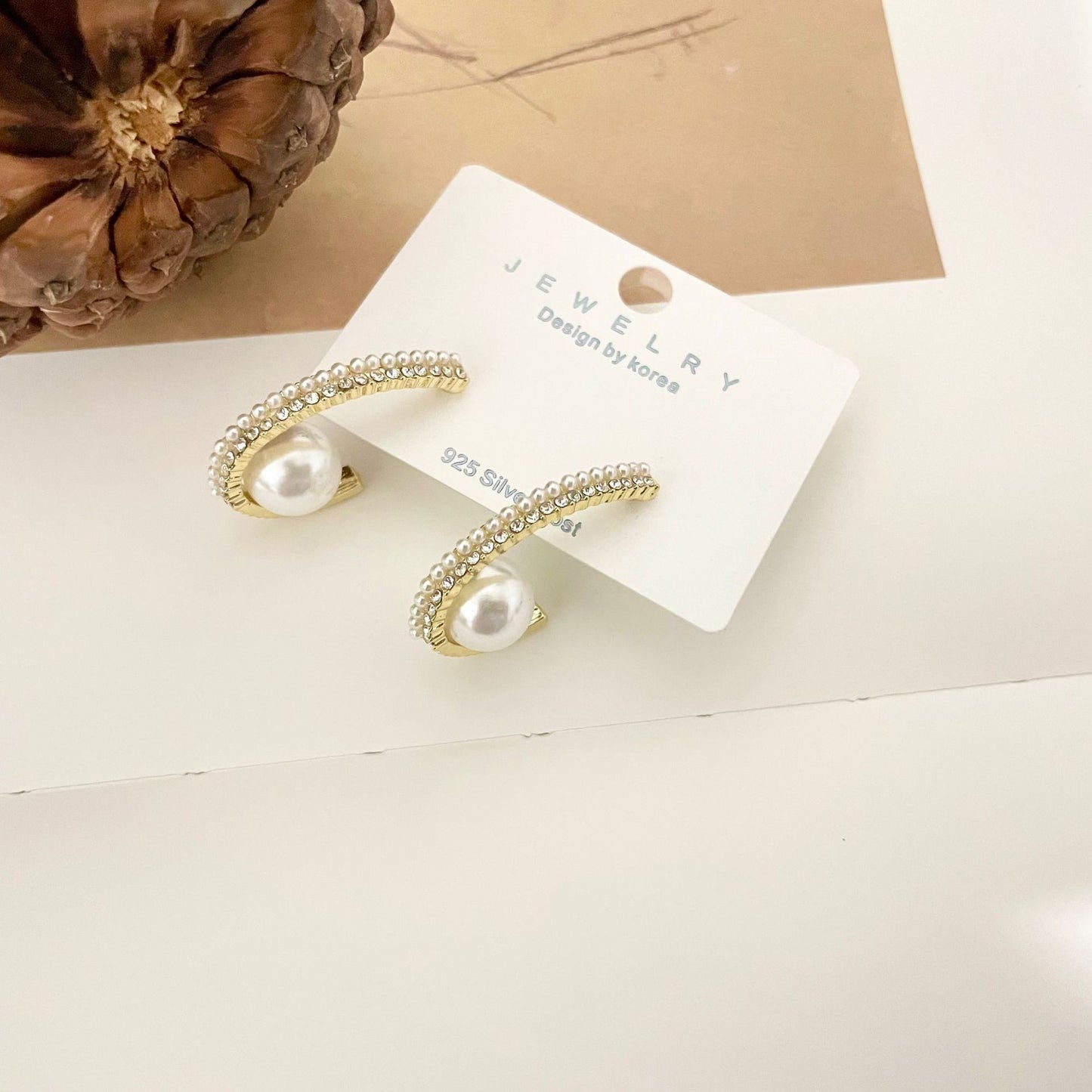 Crescent pearl earrings