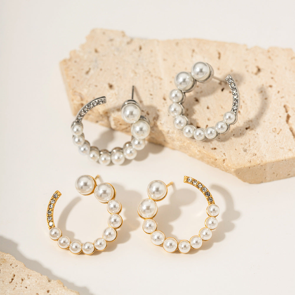 C-shaped earrings with full diamonds and pearls