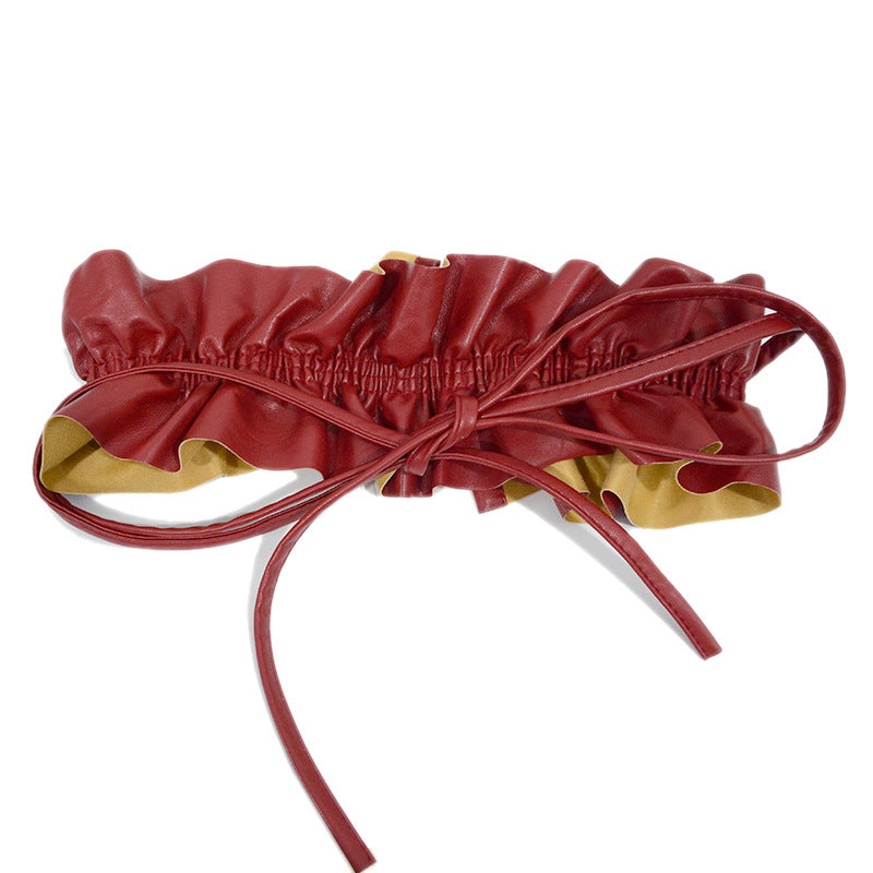 Elastic pleated edge belt