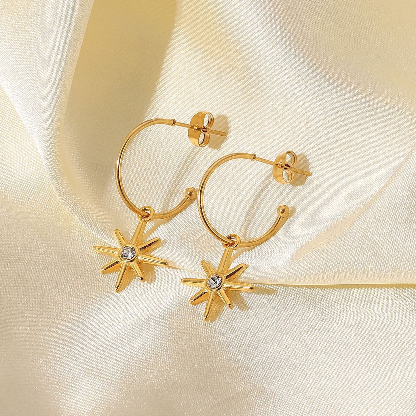 Gold C-shaped six-pointed star pendant earrings