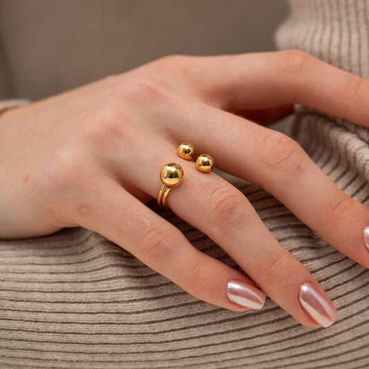 Anillo abierto tres bolas oro 