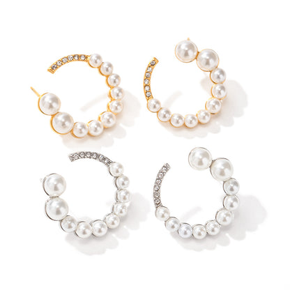 C-shaped earrings with full diamonds and pearls