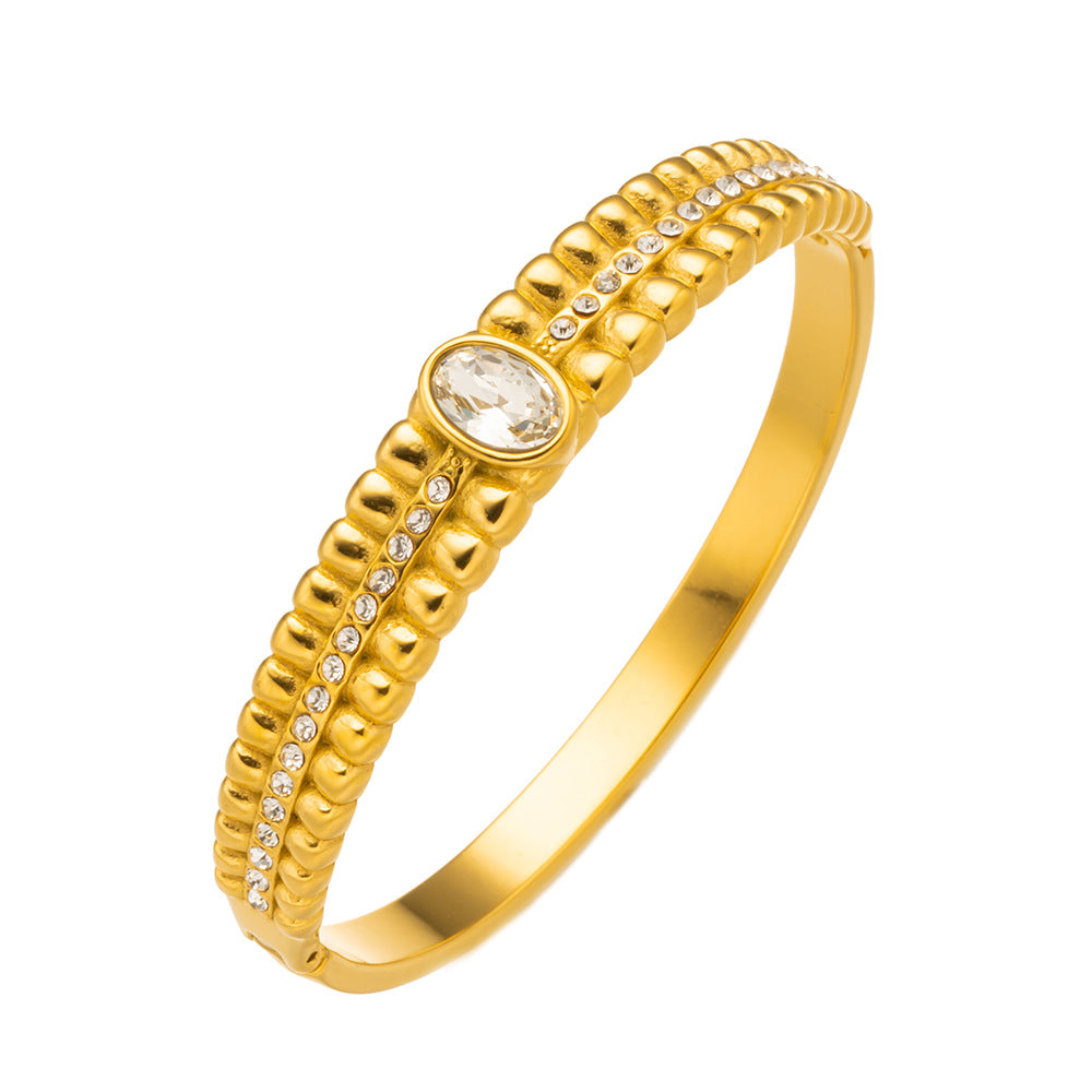 Brazalete vintage de acero inoxidable con circonitas verdes 