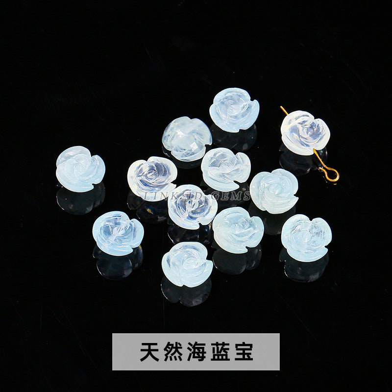 Aquamarine engraved rose inlaid with loose beads