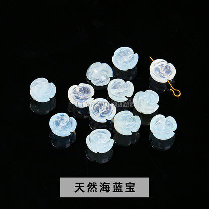 Aquamarine engraved rose inlaid with loose beads