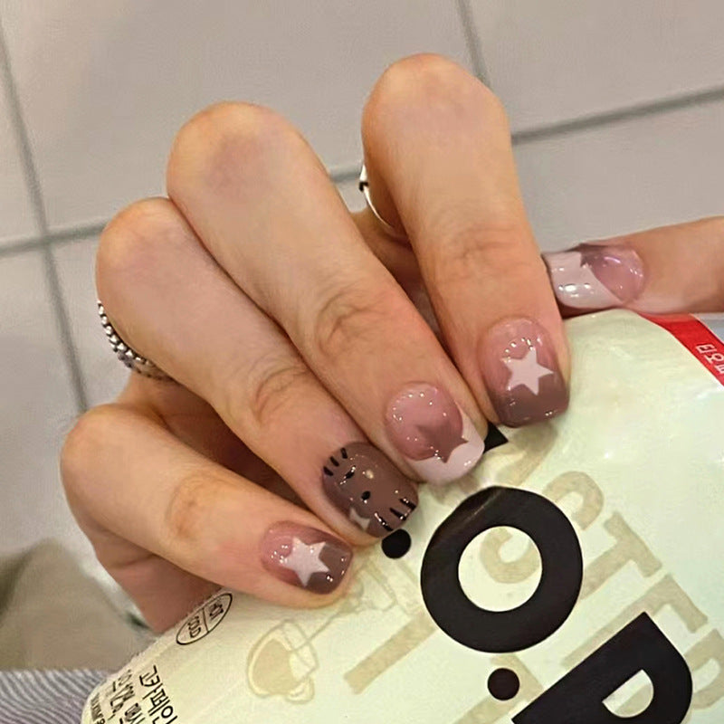 Uñas postizas francesas con forma de gato y estrella hueca 
