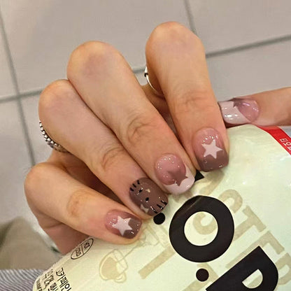 Uñas postizas francesas con forma de gato y estrella hueca 