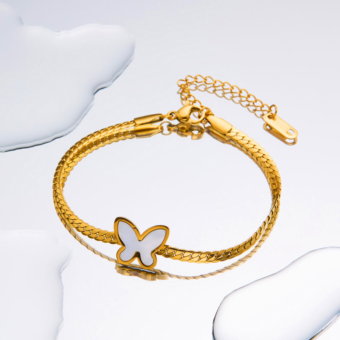 Titanium-Steel Snake Bone Whip Chain Bracelet with Four-Leaf Clover