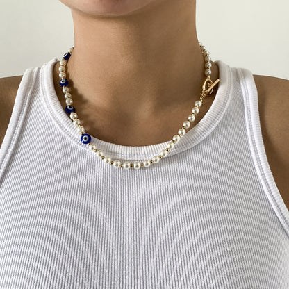 Collar de ojo de perla de imitación empalmado 