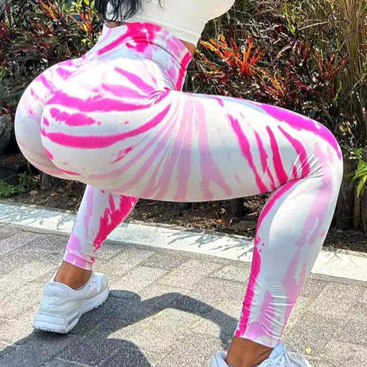 Pantalones de yoga color melocotón sin costuras con efecto tie-dye 